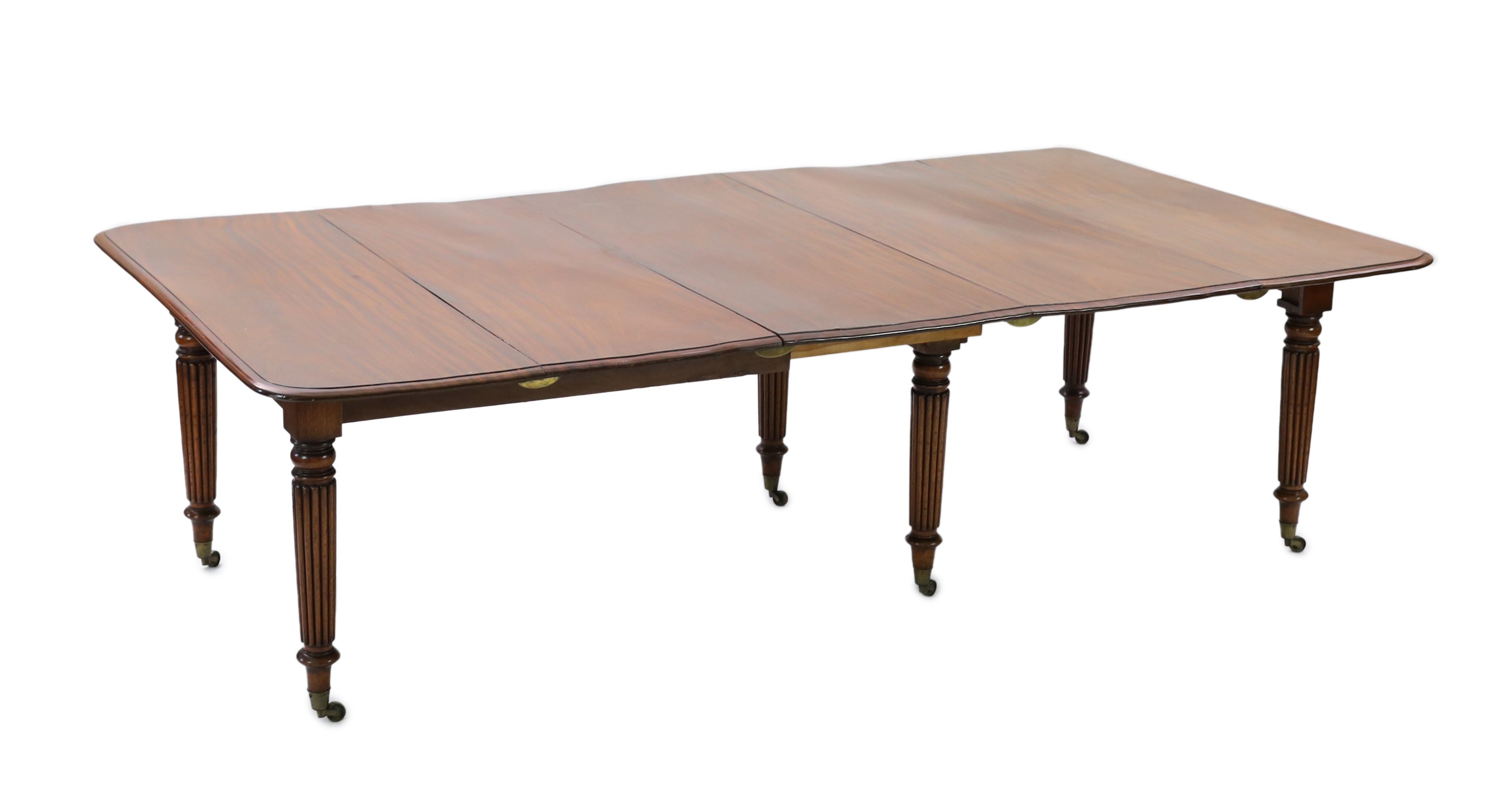 A Regency mahogany extending dining table, extends to 306cm x 135cm H.72cm